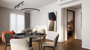 a dining room with a table and chairs at Tailormade Hotel Median Niš in Niš