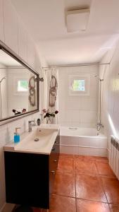 a white bathroom with a sink and a bath tub at Villa in Nature with Yoga Room, Peace and Tranquility in Puigpunyent +53 photos