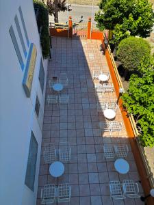 an overhead view of a patio with tables and chairs at Fuji Hotel in Edipsos +59 photos