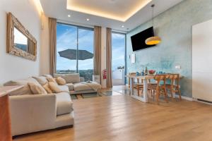 a living room with a couch and a table at MAAR Suites Cotillo in El Cotillo