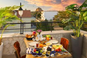 a table with food on top of a balcony at Cappadocia Golden Elite in Uçhisar +84 photos