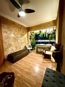 a living room with a couch and a table at Apartamento Praia da Costa in Vila Velha