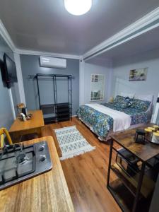 a bedroom with a bed and a stove in it at Stil Karoo in Montagu