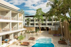 an aerial view of a hotel with a swimming pool at Wild Orchid Krabi in Ao Nam Mao