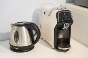 a toaster sitting on a counter next to a toaster at Alloggio Nettuno in Villasimius