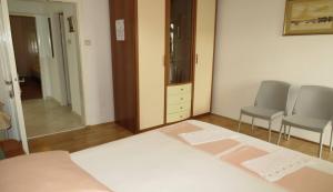 Postel nebo postele na pokoji v ubytování Apartments Ćorluka