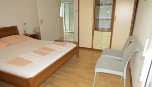 Postel nebo postele na pokoji v ubytování Apartments Ćorluka
