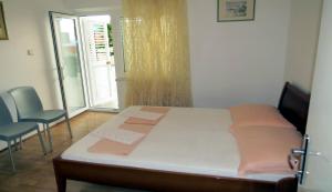 Postel nebo postele na pokoji v ubytování Apartments Ćorluka