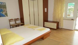 Postel nebo postele na pokoji v ubytování Apartments Ćorluka