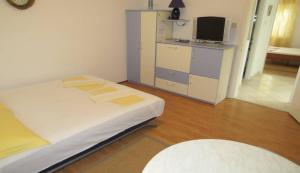 Postel nebo postele na pokoji v ubytování Apartments Ćorluka