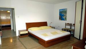 Postel nebo postele na pokoji v ubytování Apartments Ćorluka