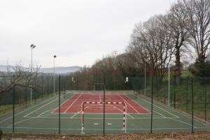 a tennis court with a net on top of it at Pazo de Bendoiro in Bendoiro