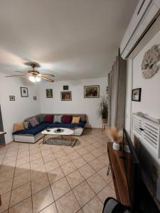 a living room with a couch and a table at Apartment Miljenko Tomić in Splitska