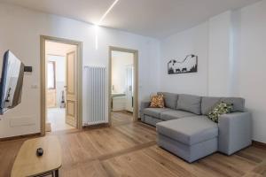 a living room with a couch and a tv at Maison Bovet Appartements in Arvier +44 photos