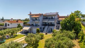 an aerial view of a house with trees at Elegant Maisonettes Elena in Nea Potidaea