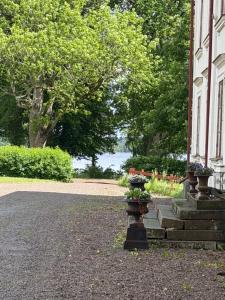 a building with stairs and plants on the side of it at Flishult gård in Vetlanda +18 photos