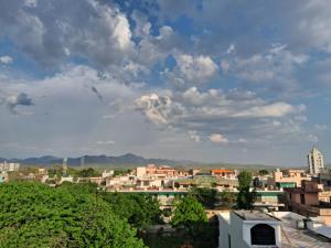a view of a city under a cloudy sky at Blue Breeze in Haridwār +29 photos
