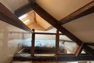 a small room with a bed in a attic at Urban Perch in Penrith