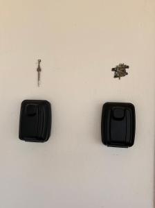 a wall with two black switches and a key at Sueña Toledo- Apartamentos turisticos con piscina in Toledo