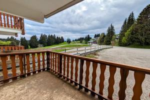a balcony of a house with a view of a road at Studio 5 personnes au revard in Les Déserts +8 photos