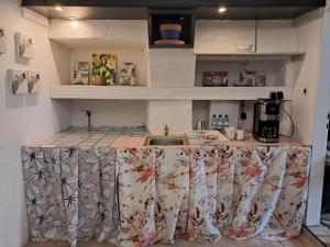 a kitchen with a sink and a counter top at sleepandgo-selfcheckinout in Weißkirchen in Steiermark