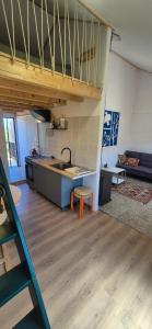 a kitchen with a sink and a counter top at Studio Juncalinho - Stylish Portuguese Studio in São Teotónio