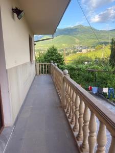 a balcony with a view of the mountains at BEAUTI-House in Ijevan +6 photos