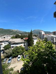 a city with cars parked in a parking lot at Bar holiday apartment Kastro in Bar