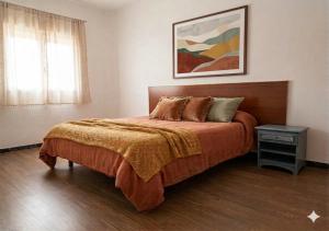 a bedroom with a large bed and a night stand at Hostal Urgell in Balaguer