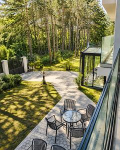 a patio with chairs and a table on a patio at Teracite in Varna City
