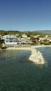 a view of a beach with buildings and the water at Golden Coast Boutique - Luxury Living in Kypseli