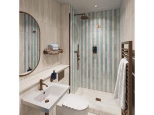 a bathroom with a sink and a mirror at Elysium St Mawes in Saint Mawes