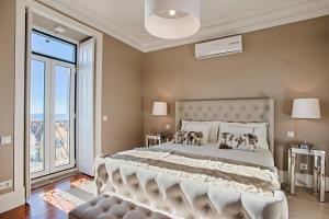 Ένα ή περισσότερα κρεβάτια σε δωμάτιο στο Saboia House 515 by Saboia Collection