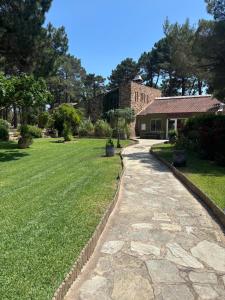a stone walkway in front of a house at Kilina in Porto-Vecchio