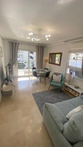 a living room with a couch and a table at Sunylife in Albir