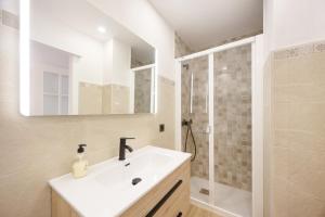 a bathroom with a sink and a shower at Casapoley Vejer in Vejer de la Frontera +23 photos