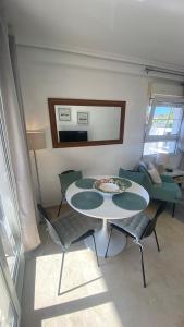 a living room with a table and chairs and a couch at Sunylife in Albir