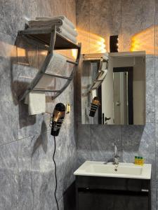 a bathroom with a sink and a mirror at Antik Otel in Ankara