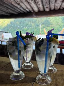 a group of three wine glasses sitting on a table at Firefly in Shatili