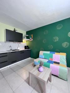 a living room with a couch and a table at Galini Apartments in Litochoro