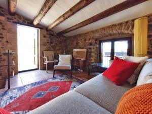 a living room with a couch and a table at Casa historica en Corçà, Baix Empordà in Corçà