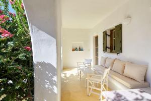 a living room with a couch and a table at Villa Joy in Aliki