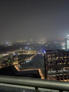 a view of a city at night with lights at Skyvera Stay at Supernova Spira in New Delhi