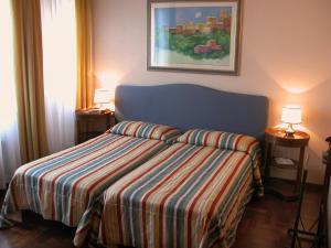 Postel nebo postele na pokoji v ubytování Hotel Torretta + 20 fotografií