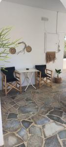 a living room with a table and two chairs at Antonia in Galissas
