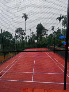 a tennis court with a net on top of it at Wild Nest Resort, Wayanad in Meppādi +12 photos