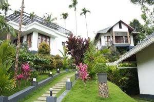 a house with a garden in front of it at Wild Nest Resort, Wayanad in Meppādi