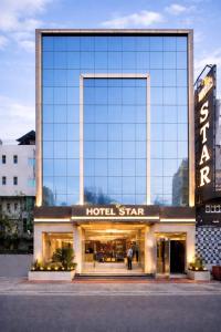 a large building with a hotel sign on it at Hotel Aero Star by Star Group in New Delhi