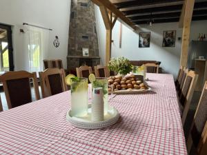 a table with a red and white checkered table cloth at Csodaszarvas Erdeiház in Borzont +18 photos