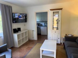 a living room with a couch and a table at Strandoase in Grömitz